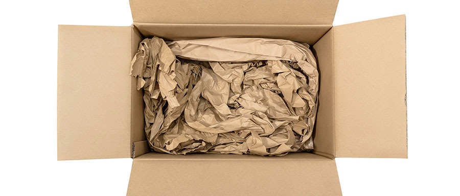 packing paper at bottom of moving box