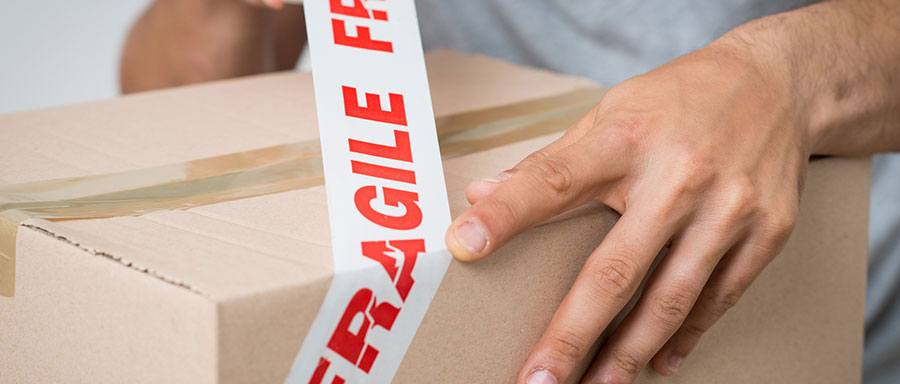 wrap boxes with fragile tape